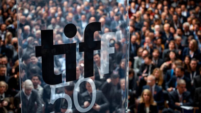 make it more realistic and add banner name of tiff 50  show crowds and make professional